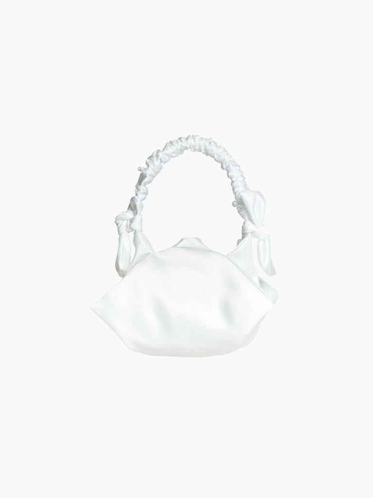 white satin ruched handle handbag with decorative bows, set on a white background