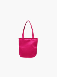 A fuchsia satin tote bag with. It features matching handles, set against a plain white background.
