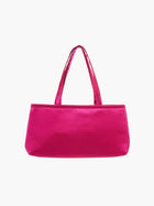A rectangular fuschia handbag with double handles, made of silky fabric, is centered against a white background, conveying a simple and elegant style.