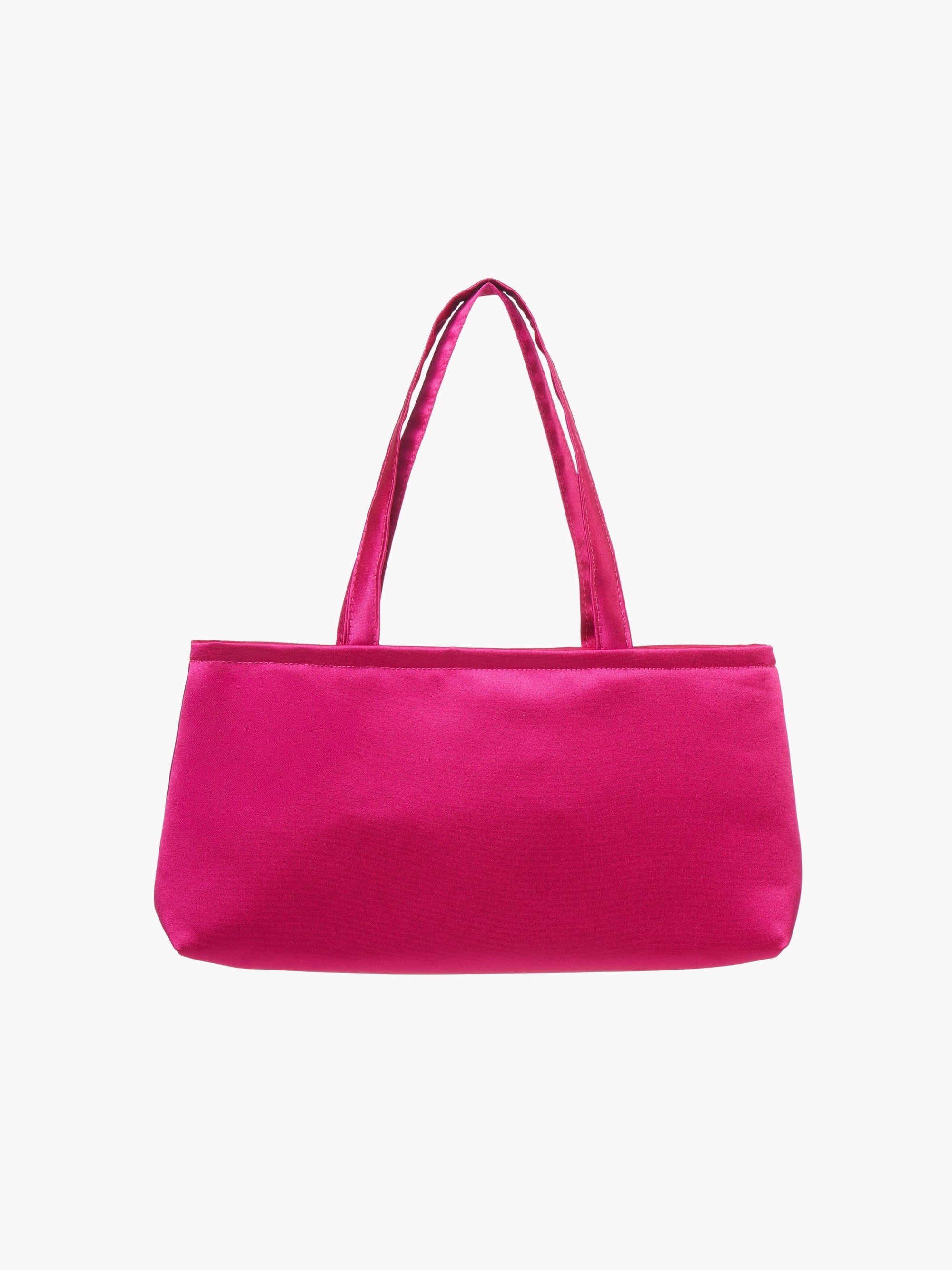 A rectangular fuschia handbag with double handles, made of silky fabric, is centered against a white background, conveying a simple and elegant style.