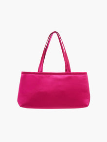 A rectangular fuschia handbag with double handles, made of silky fabric, is centered against a white background, conveying a simple and elegant style.