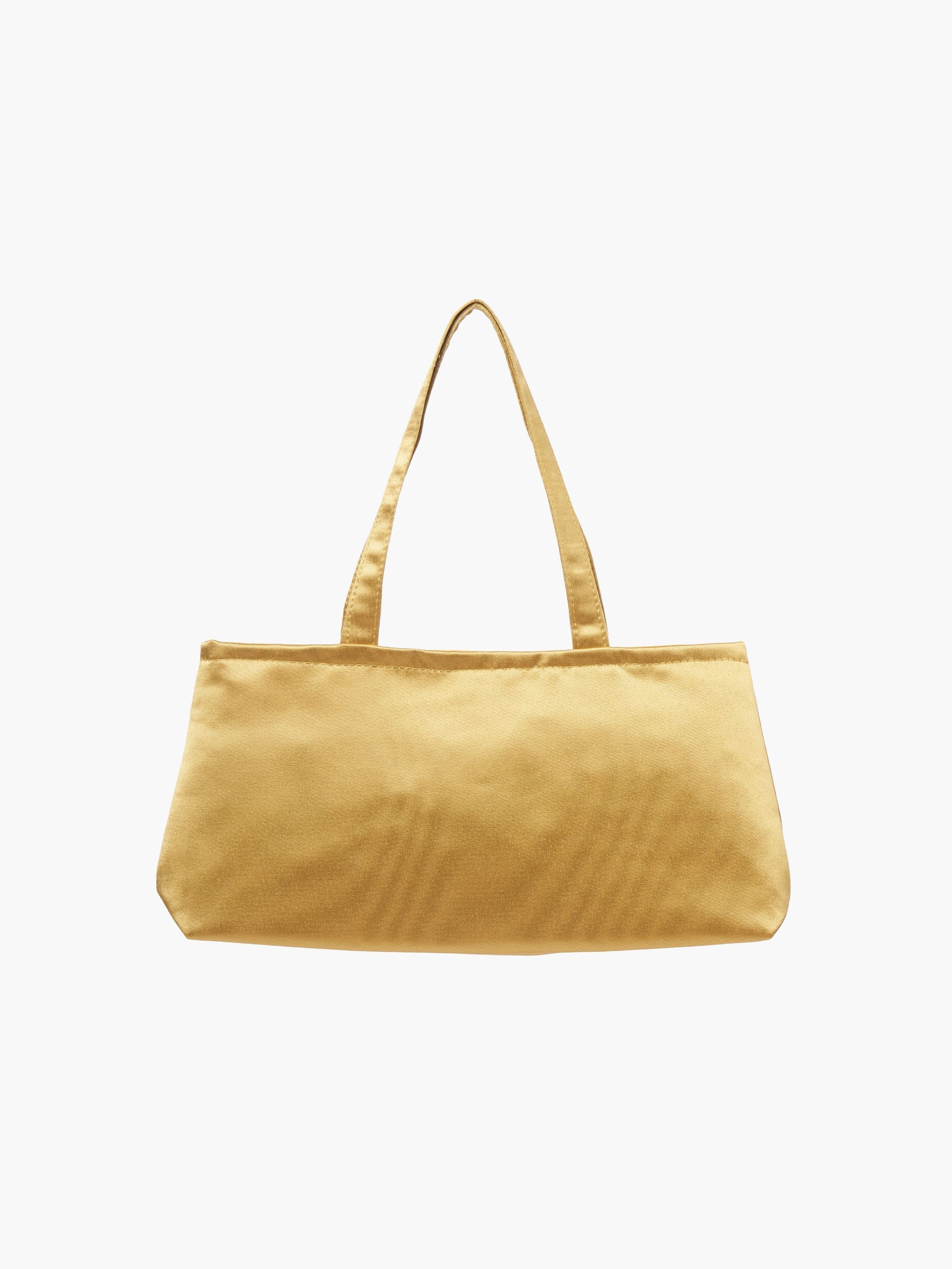 A sleek gold handbag with a minimalist design, featuring a rectangular shape and two thin straps. The tone is elegant and versatile against a plain white background.