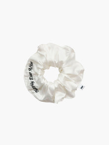 Ivory bamboo silk satin scrunchie with 'Happily Ever After' embroidered in black on a white background.