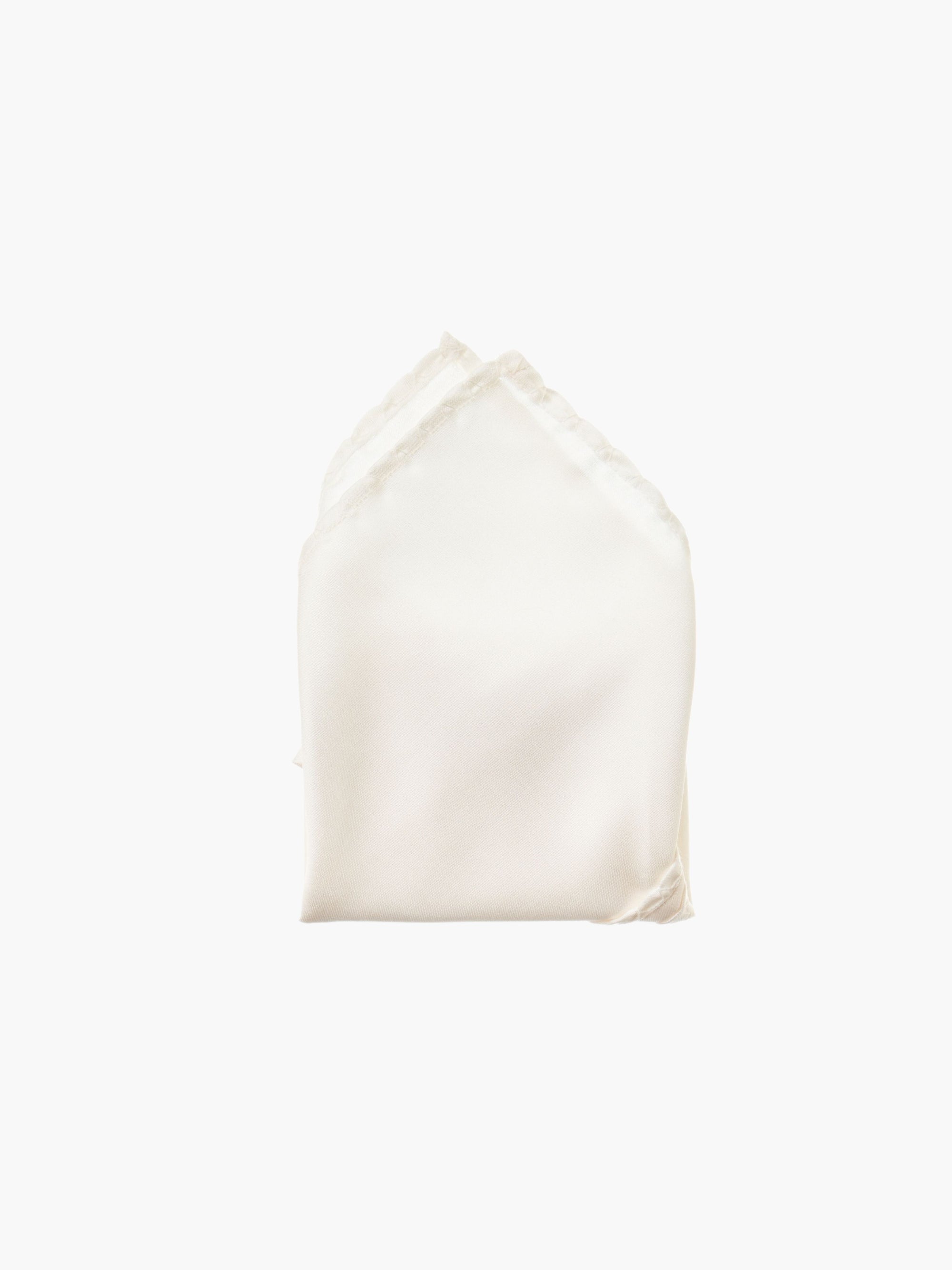 An ivory folded pocket square made from silk, set against a white background.