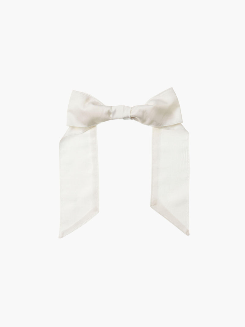 Ivory bamboo silk satin hair bow clip on a white background