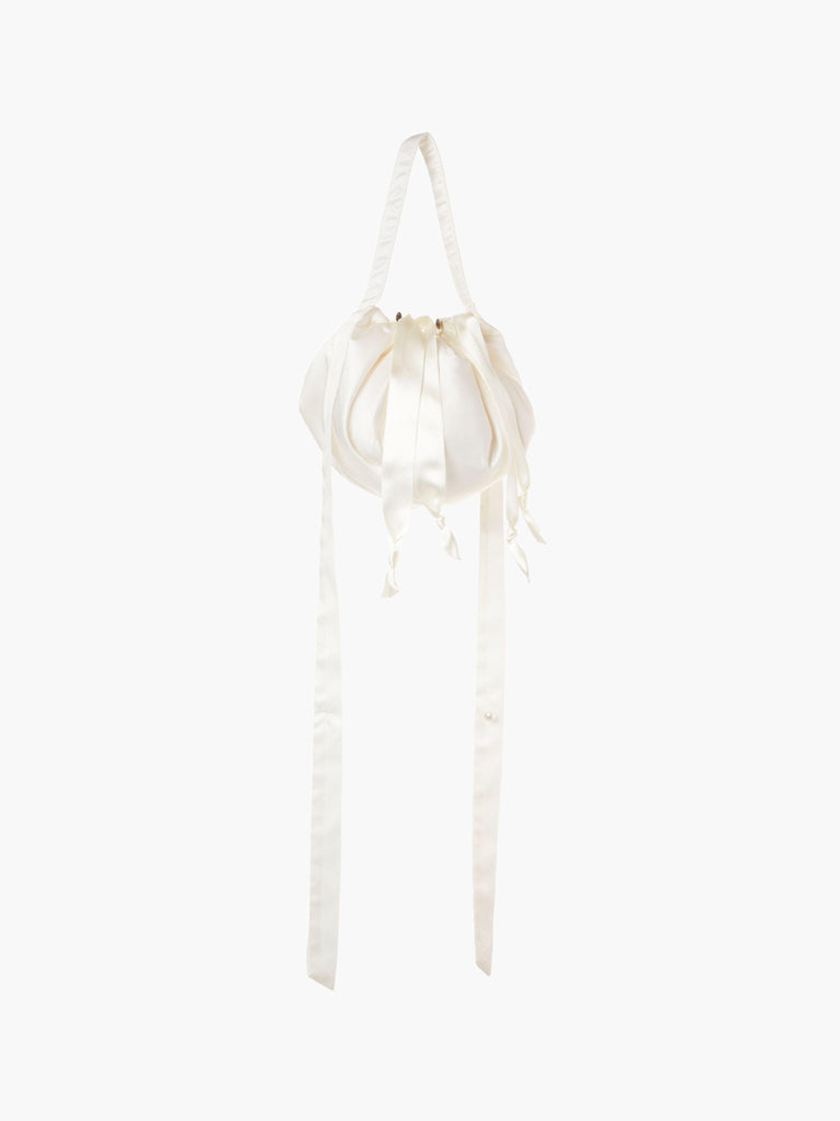 Ivory bamboo silk satin ribbon drawstring puffball bag with long straps, set on a white background