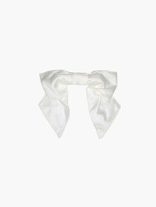 Ivory bamboo silk satin bridal hair bow scrunchie. Set on a white background.