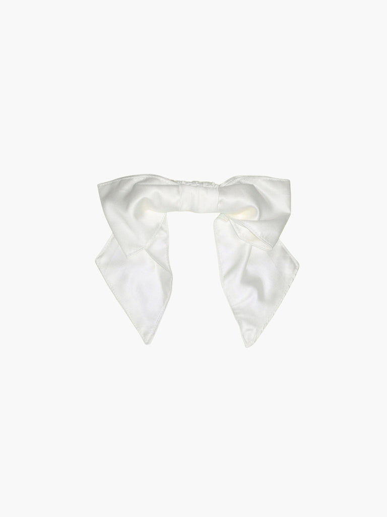 Ivory bamboo silk satin bridal hair bow scrunchie. Set on a white background.