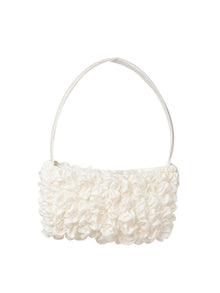 Ivory bamboo silk satin textured ruched front handbag. Set on a white background.