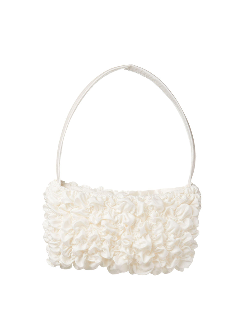 Ivory bamboo silk satin textured ruched front handbag. Set on a white background.