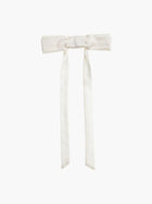 Ivory bamboo silk satin bow hair clip on a white background
