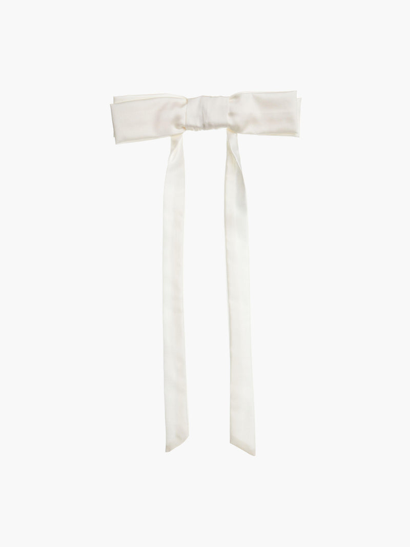 Ivory bamboo silk satin bow hair clip on a white background