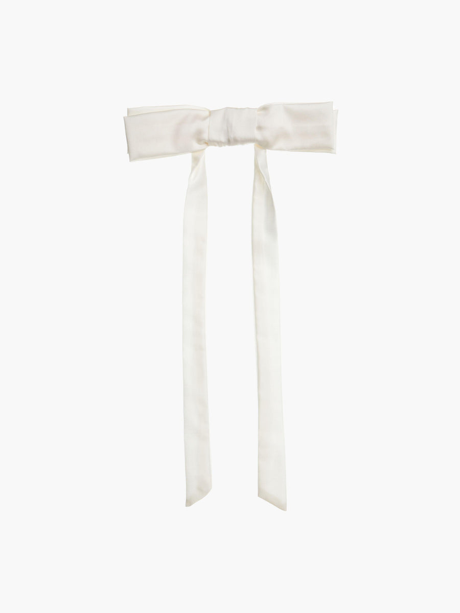 Ivory bamboo silk satin bow hair clip on a white background