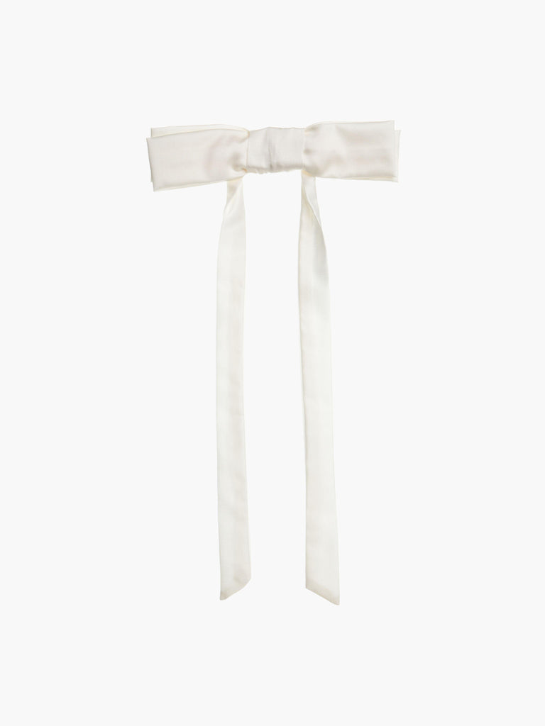Ivory bamboo silk satin bow hair clip on a white background