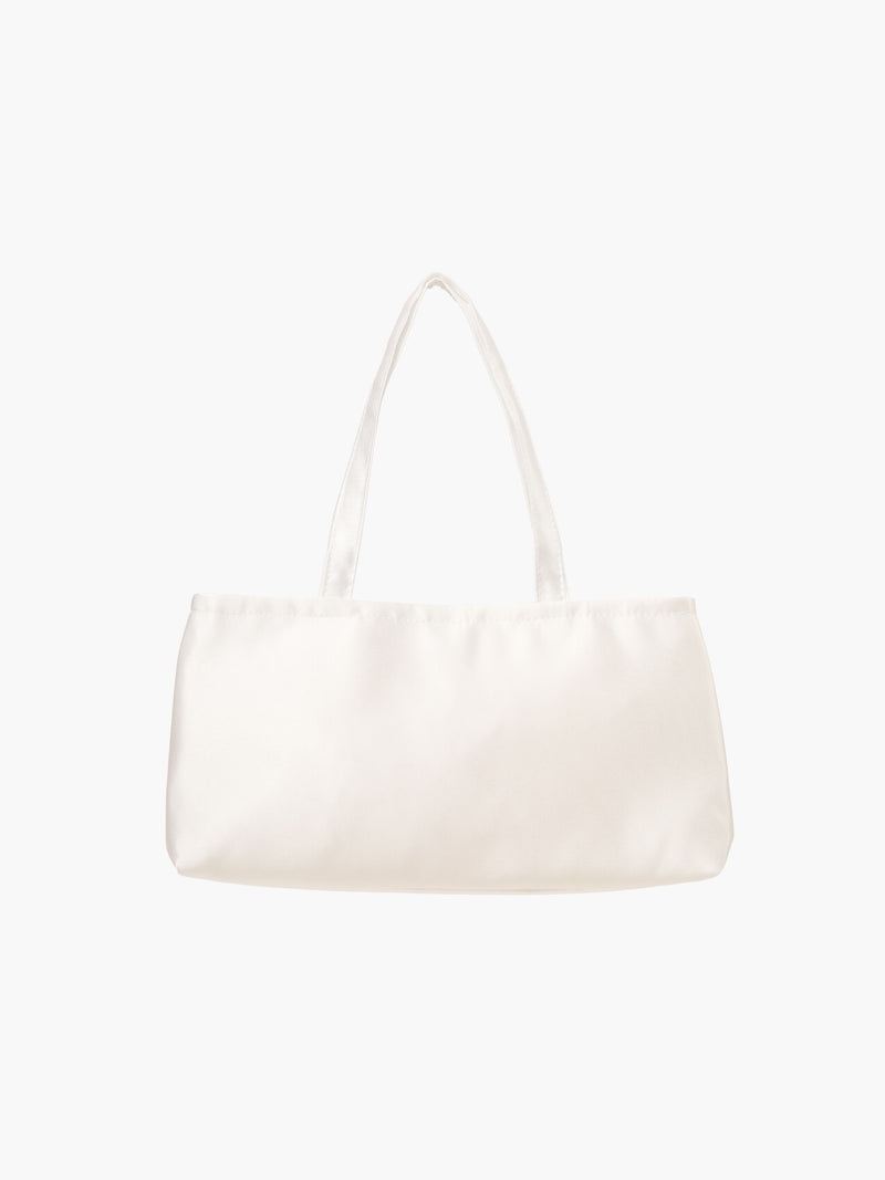 An ivory satin baguette shape handbag with two handles. 