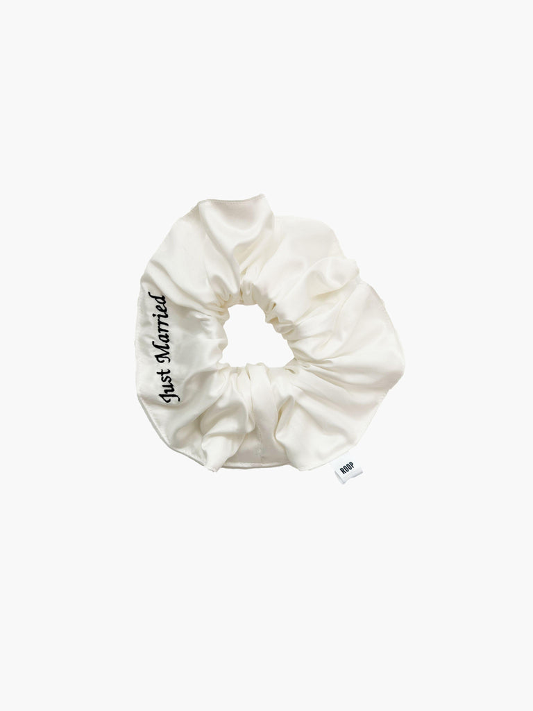 Ivory bamboo silk satin scrunchie with 'Just Married' embroidered in black on a white background.