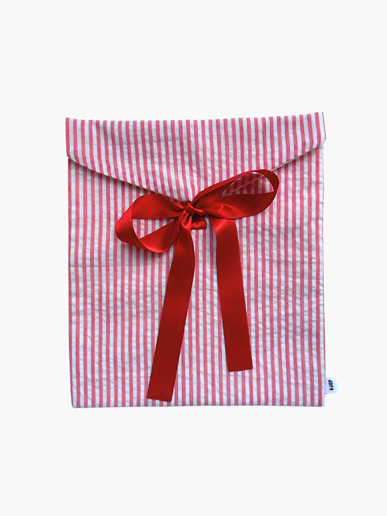 Red and white striped fabric envelope gift pouch tied with a red ribbon on a white background
