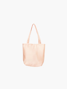 A peach satin tote bag with. It features matching handles, set against a plain white background.