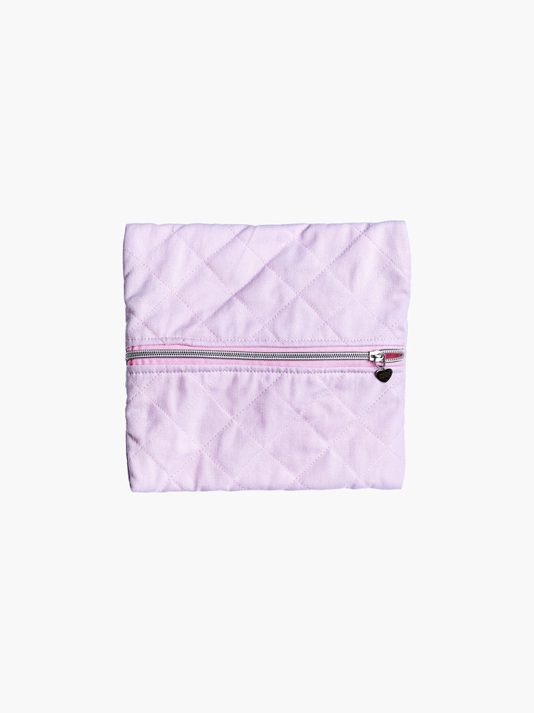 A quilted pink cotton zipper pouch, the zip has a heart charm on it. Set on a white background.