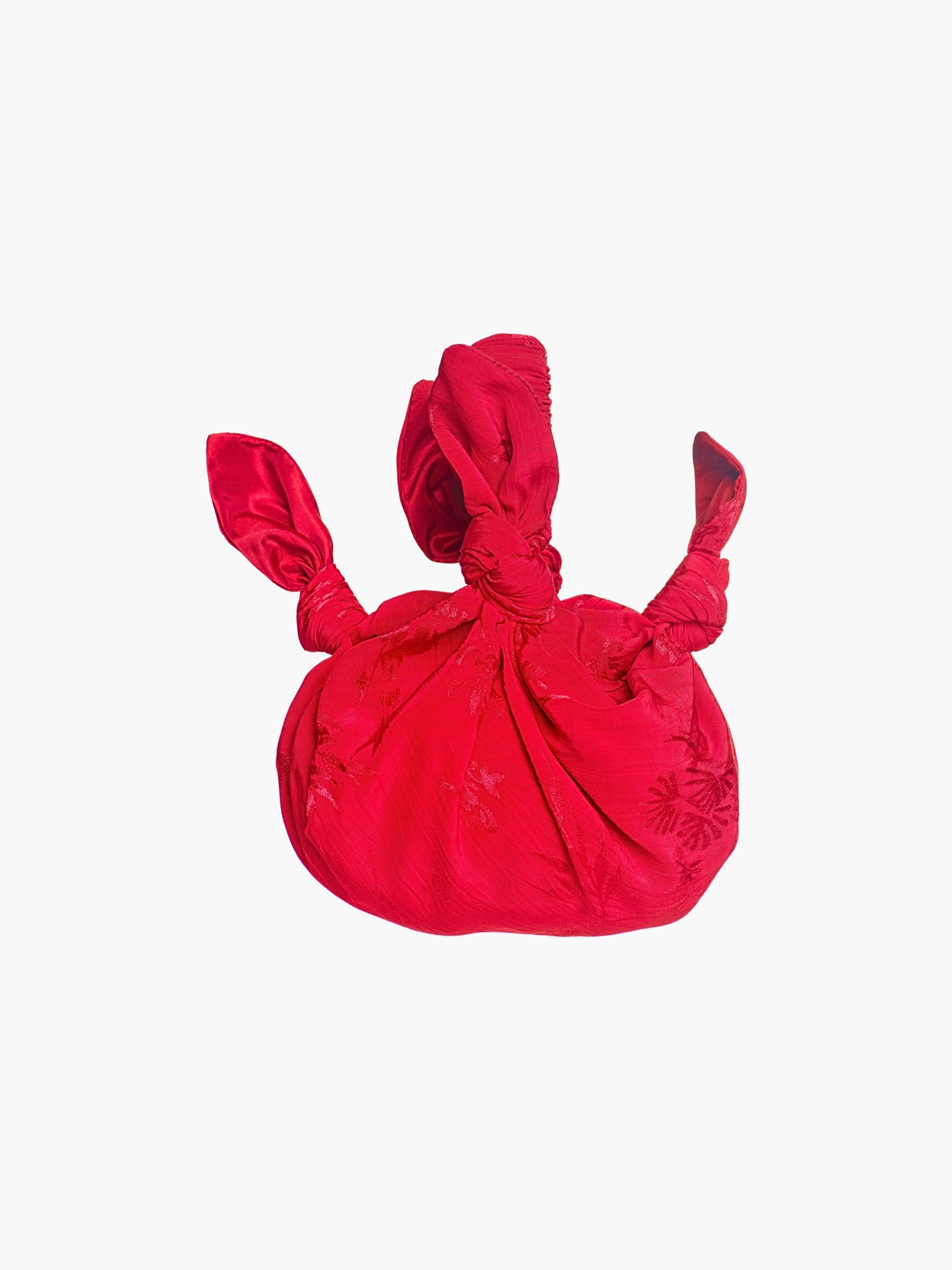 rd floral satin knotted handbag on a white background
