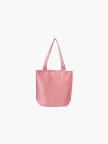 A rose pink satin tote bag. It features matching handles, set against a plain white background.