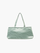 A sea green, rectangular handbag with two thin handles, set against a plain white background. The bag design is simple and elegant.