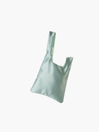 Sea green satin knot bag against a plain white background. The elegant bag has a twisted handle and sleek, glossy fabric, exuding a chic, minimalist style.