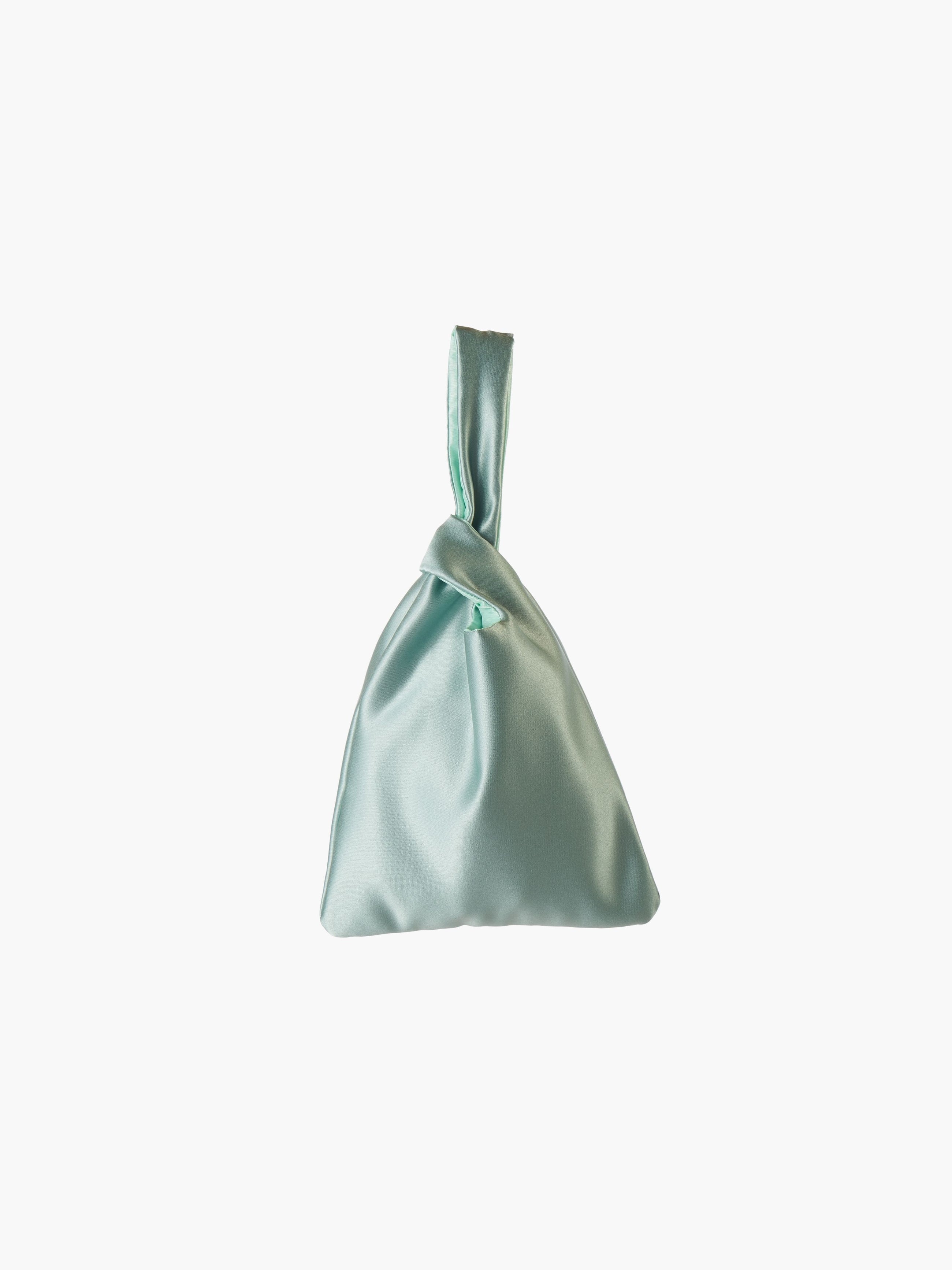Sea green satin knot bag against a plain white background. The elegant bag has a twisted handle and sleek, glossy fabric, exuding a chic, minimalist style.