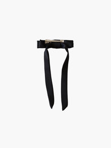 back view of a black satin bow hair clip with a silver crocodile clip on a white background