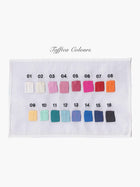 Colour swatch chart with 16 taffeta colours on a white piece of fabric with black embroidered numbers 1-16 above each colour , set on a white background