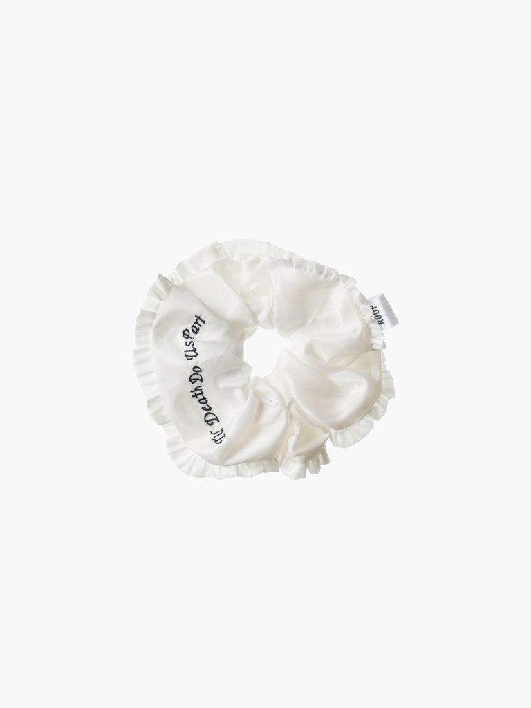 Ivory ruffled scrunchie with black embroidery that reads 'Til death do us part' on a white background