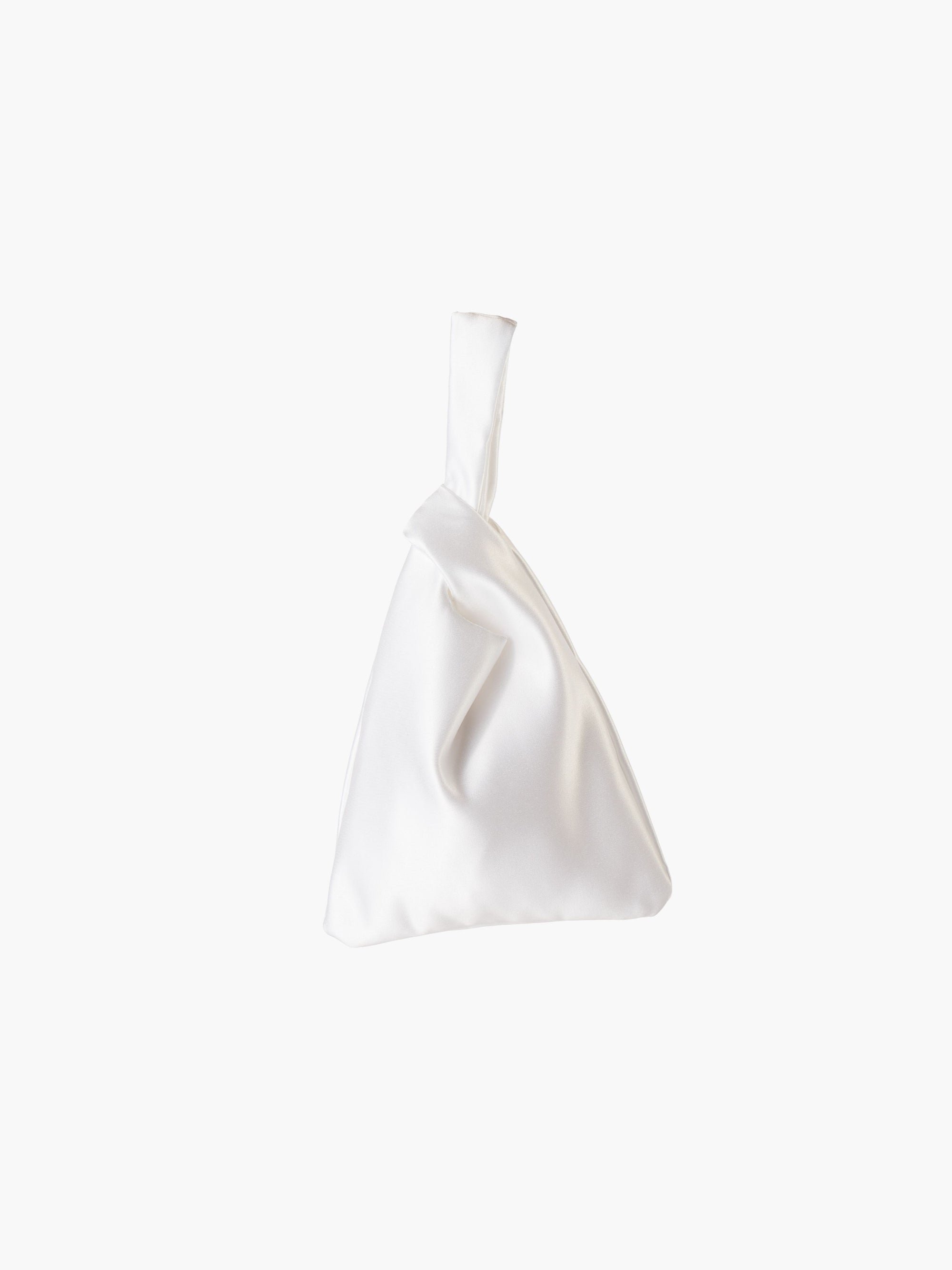 White satin knot bag against a plain white background. The elegant bag has a twisted handle and sleek, glossy fabric, exuding a chic, minimalist style.