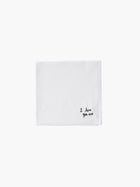 A white cotton embroidered square handkerchief, embroidered with "I love you" in black.