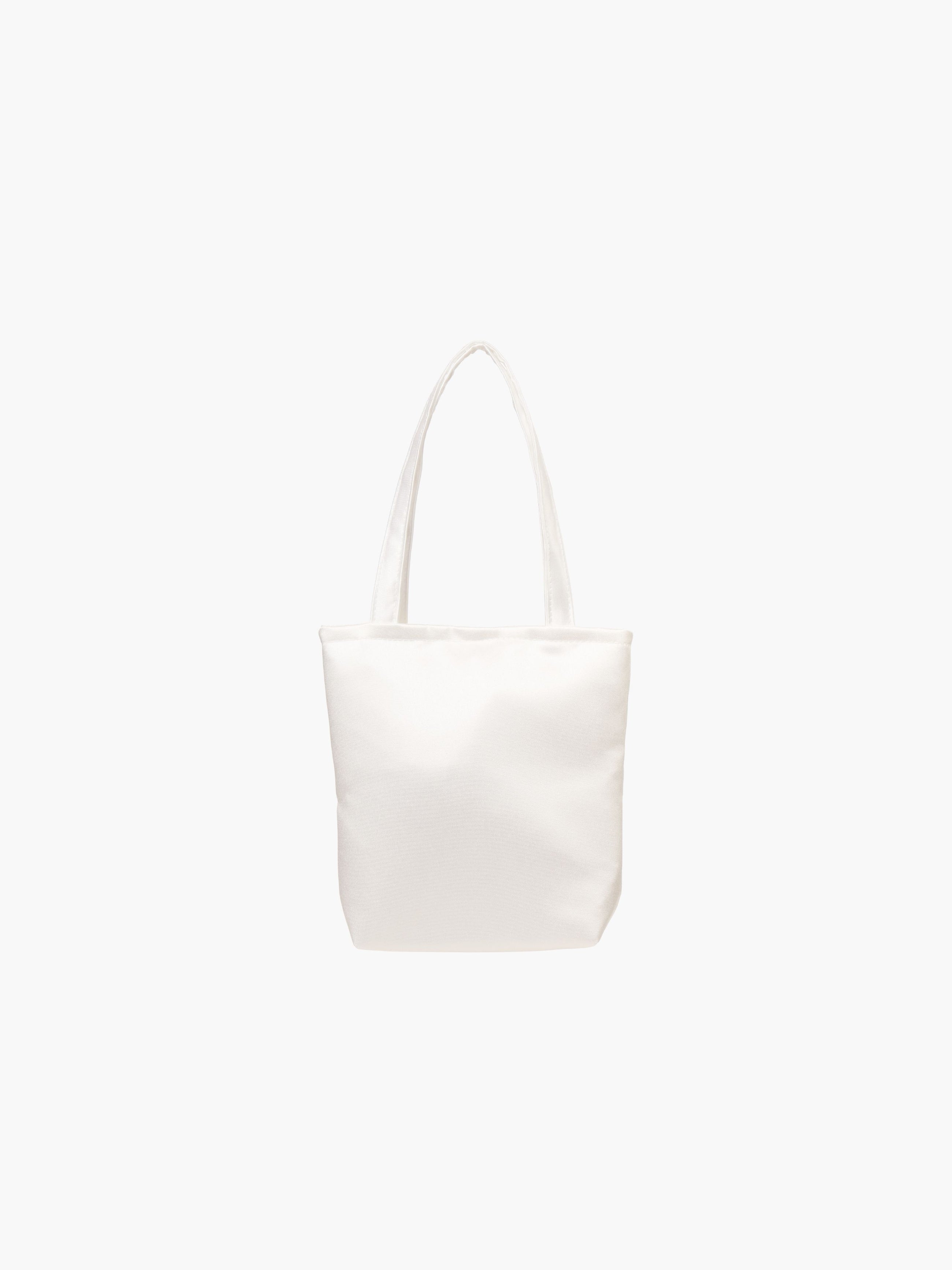 A white satin tote bag. It features matching handles, set against a plain white background.