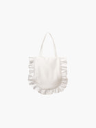 A white satin tote bag with ruffled edges on the sides and bottom. It features matching handles, set against a plain white background.