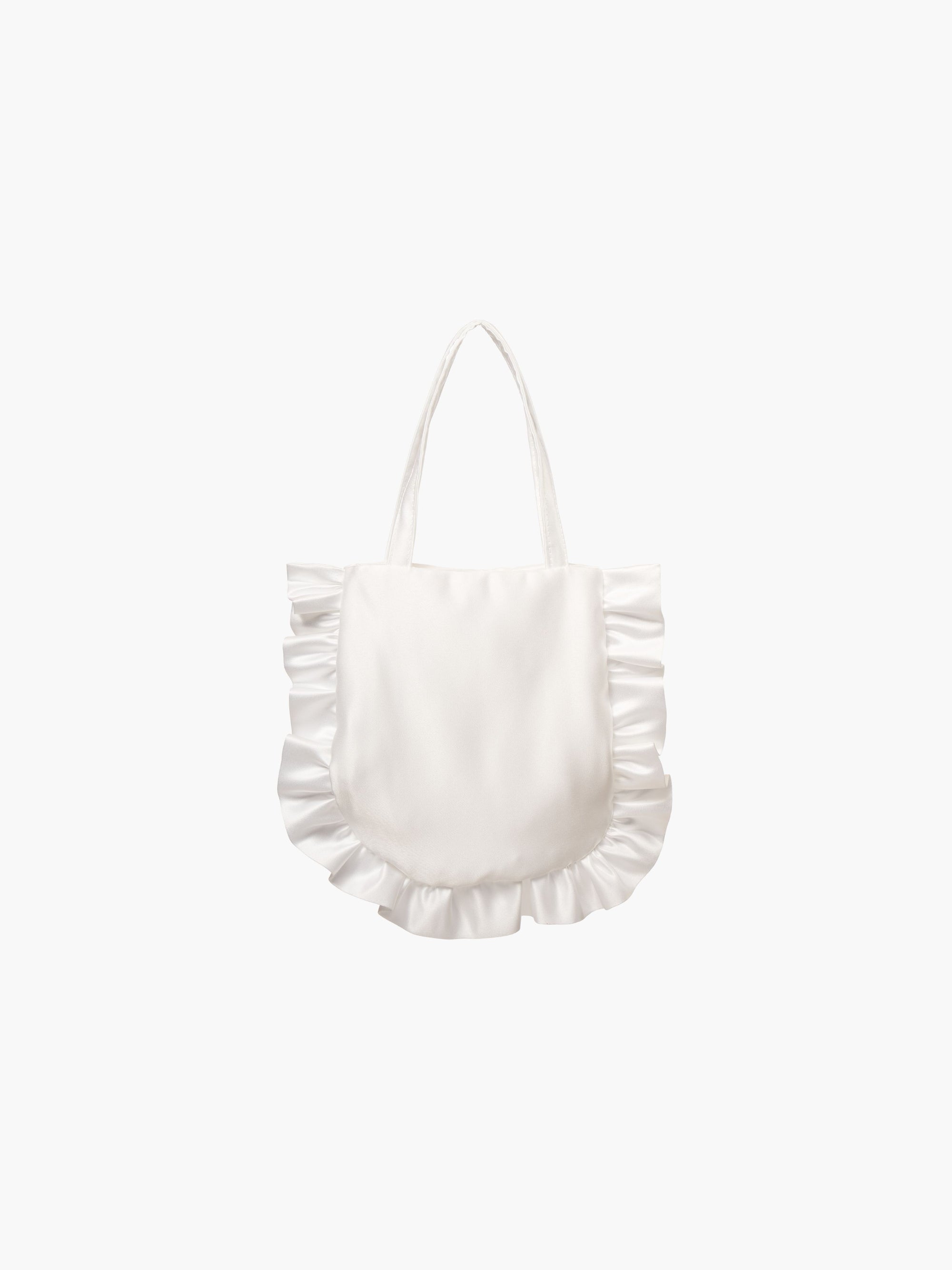 A white satin tote bag with ruffled edges on the sides and bottom. It features matching handles, set against a plain white background.