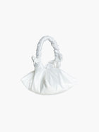 White satin ruched handle handbag with decorative bows, set on a white background