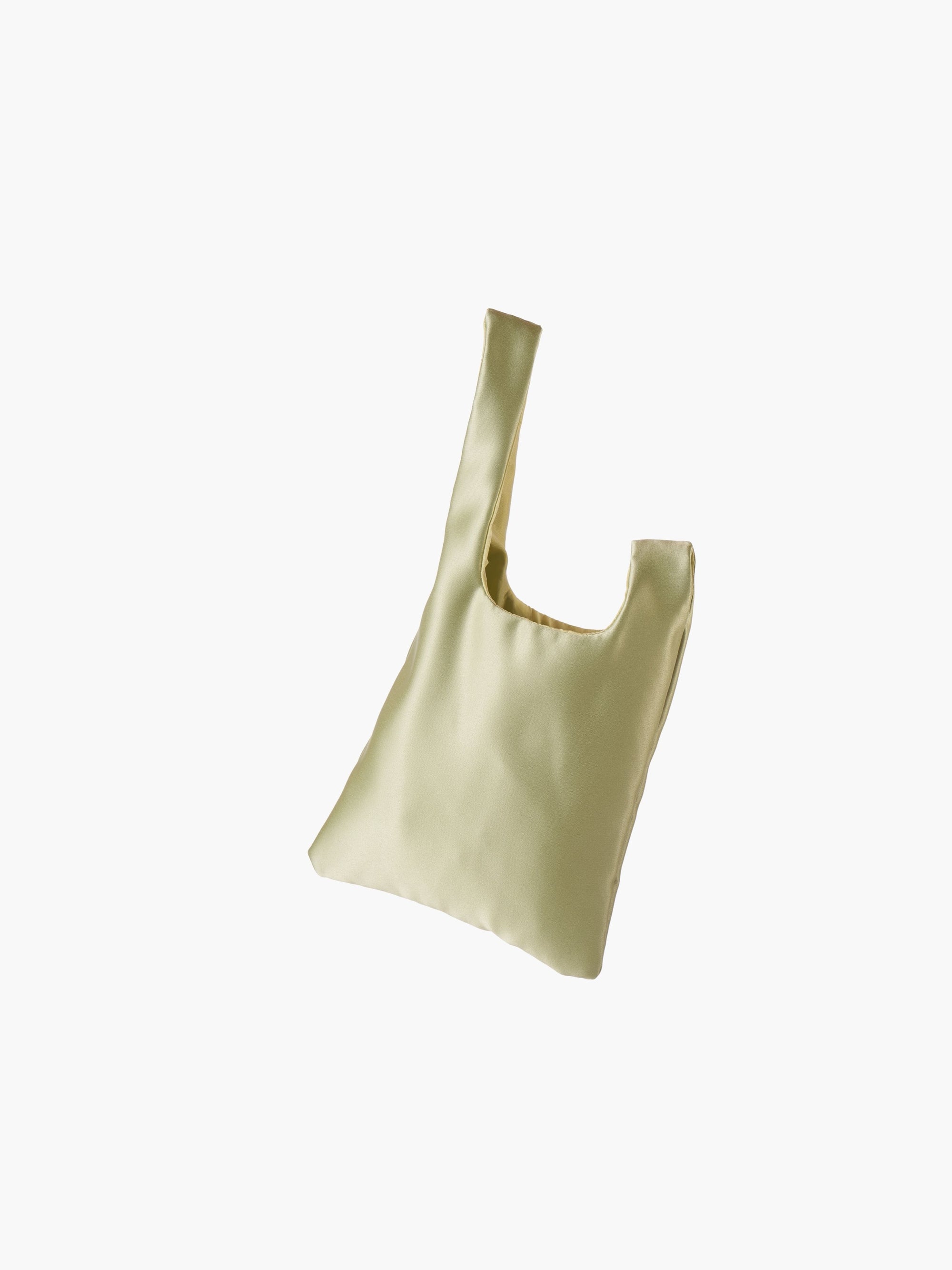 Willow green satin knot bag against a plain white background. The elegant bag has a twisted handle and sleek, glossy fabric, exuding a chic, minimalist style.