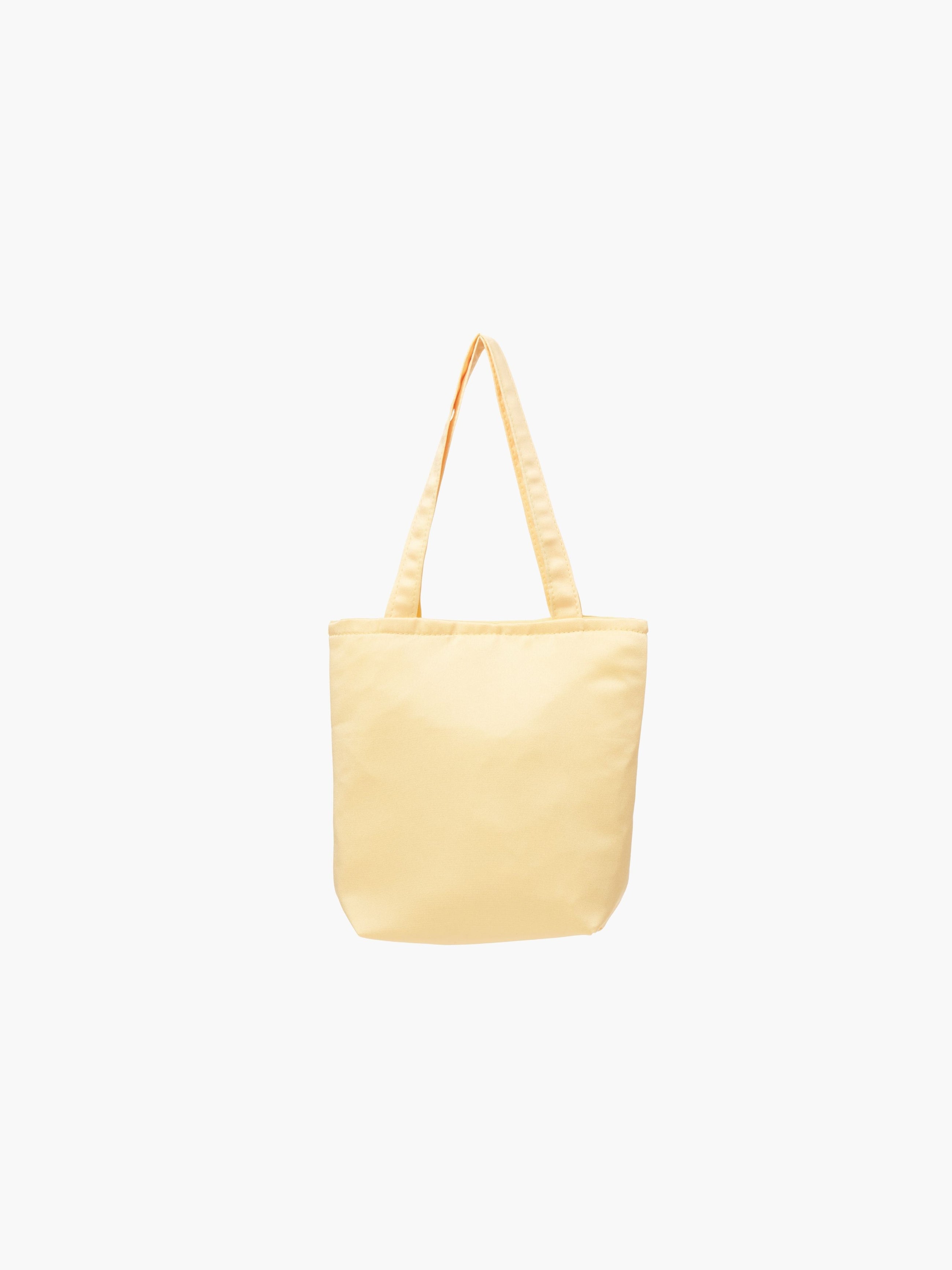 A yellow satin tote bag. It features matching handles, set against a plain white background.